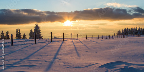 Idyllic winter scene with sunset in Austria