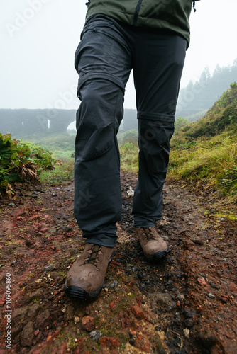 Close up of a man outdoors wearing hiking boots photo