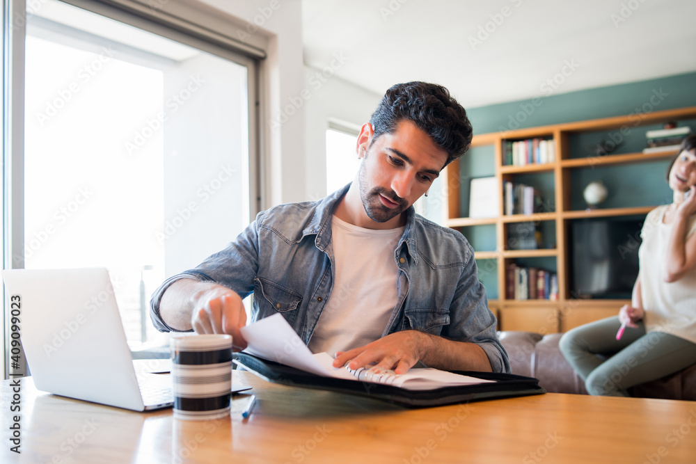 Business man working with laptop from home. Business man working with laptop from home.