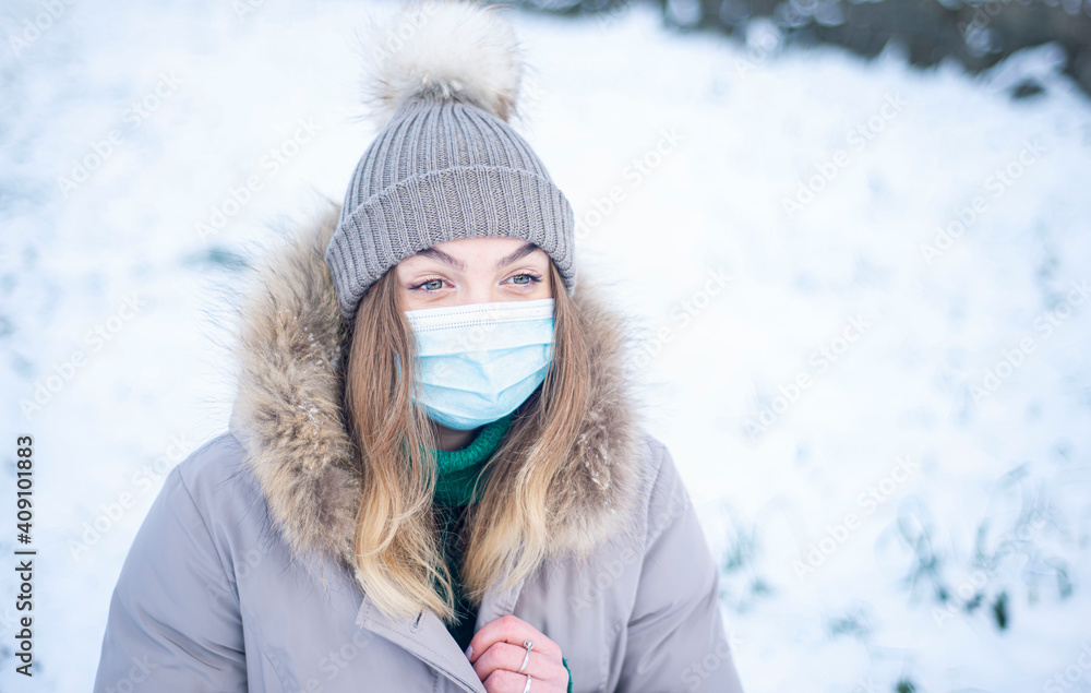 portrait of a woman in winter, a girl in a jacket and a respirator, protection against coronavirus, health care, self-isolation portrait of a woman in winter, a girl in a jacket and a respirator, protection against coronavirus, health care, self-isolation