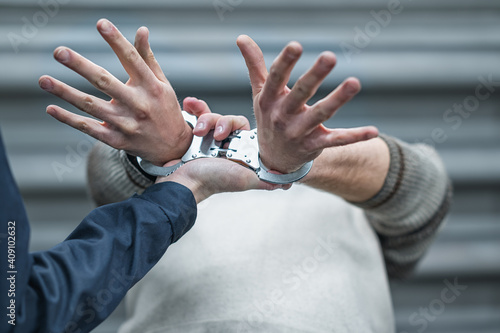 Wallpaper Mural handcuffs on the prisoner. Making an arrest. The convoy Torontodigital.ca
