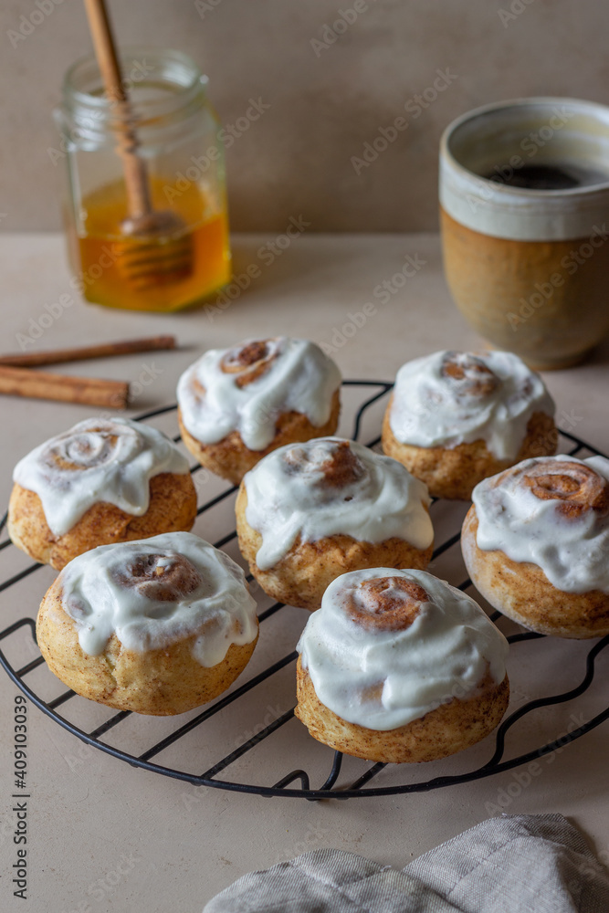 Sweet cinnamon buns with glaze. Pastries. Breakfast. Sweet cinnamon buns with glaze. Pastries. Breakfast.
