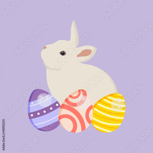 Decorated colorful Easter eggs with a cute white bunny.  