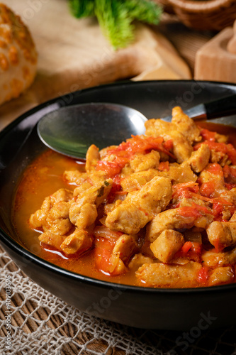 Chicken fricassee with red paprika and onion.