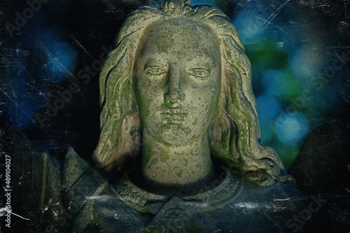 Angel of peace. Retro styled image of an ancient stone statue.