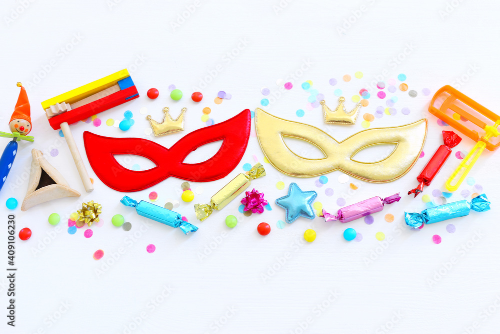 Purim celebration concept (jewish carnival holiday) over wooden white background. Top view, flat lay Purim celebration concept (jewish carnival holiday) over wooden white background. Top view, flat lay