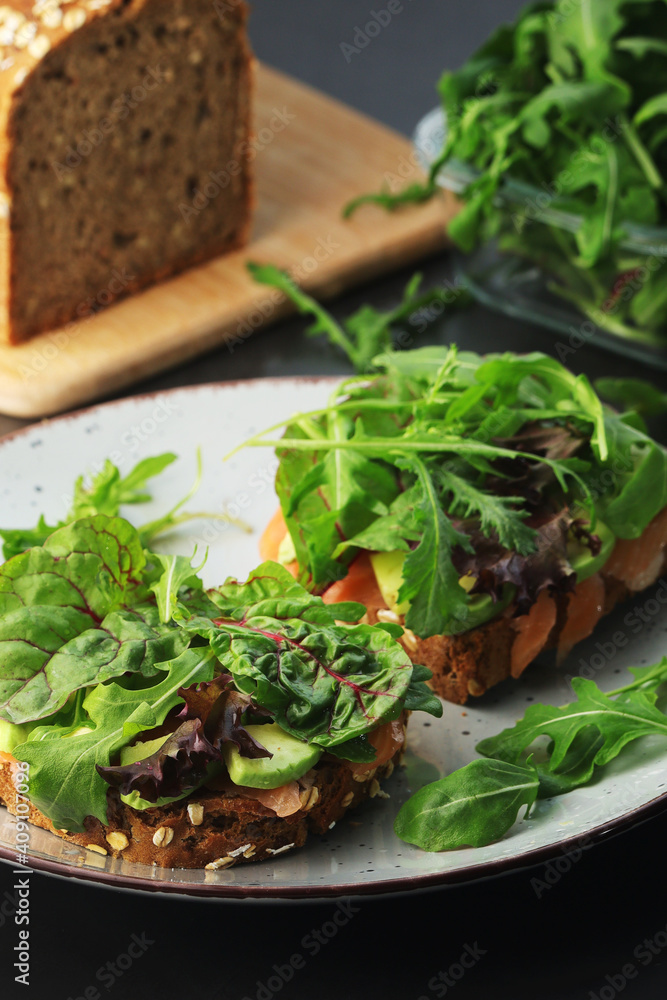 Sandwiches with salmon, avocado and salad Sandwiches with salmon, avocado and salad