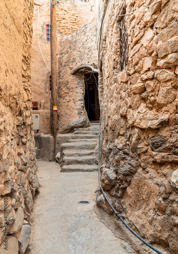 Narrow alleyway in the old mountain village Misfat Al Abriyeen in Sultanate of Oman. photo