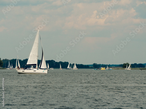 Beldany lake, Masuria, Poland, 28 of July 2020. Yachts sailing during windy summer day.
