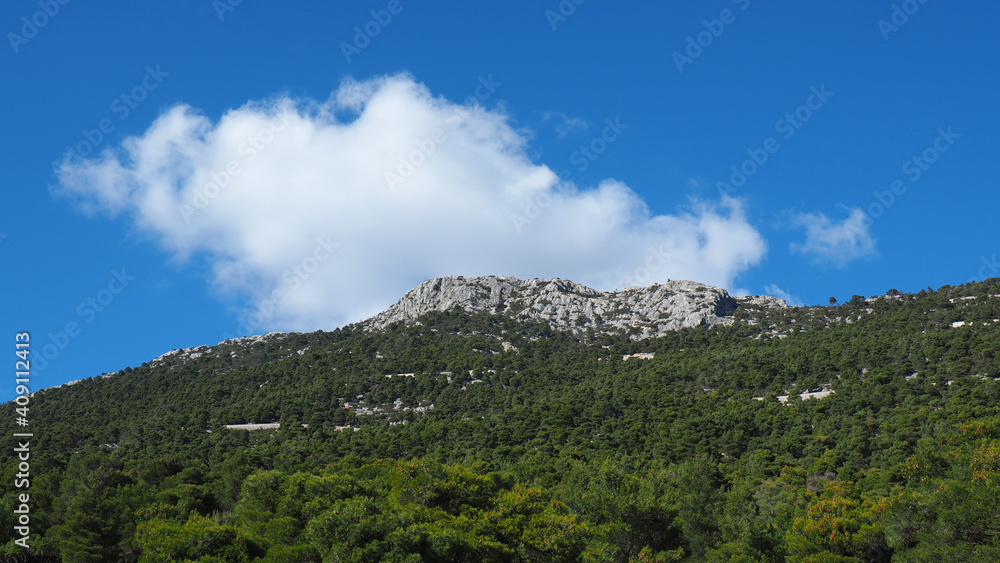 Beautiful mountain of Parnitha on a winter cloudy morning with clear blue sky, Attica, Greece