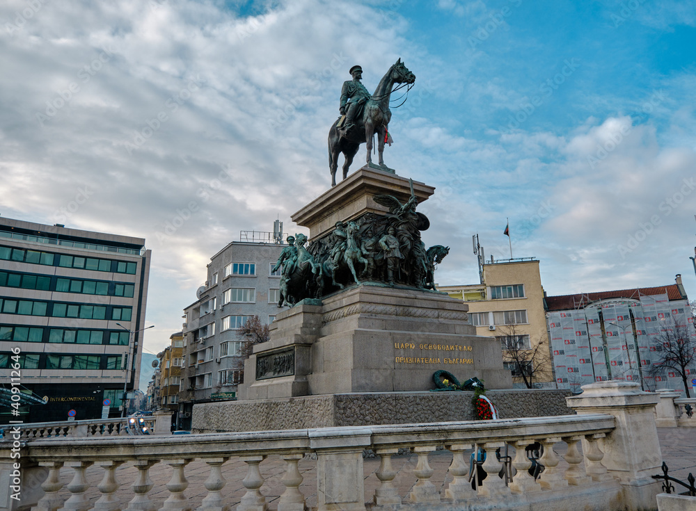 Statue of Tsar Alexander II in center of capital city of Bulgaria: Sofia. Statue with blue sky background during sunny day. 