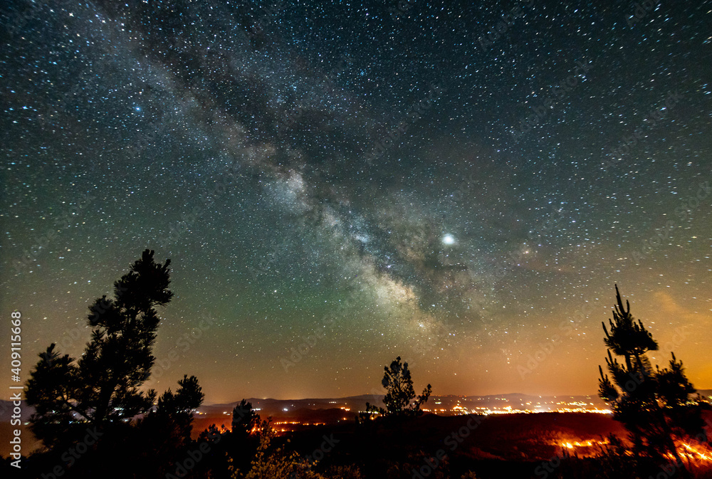 Night sky with the Milky Way over a lookout point 