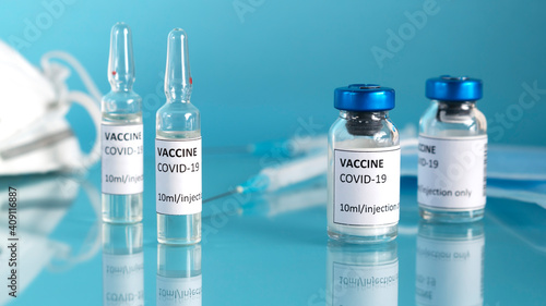 Coronavirus vaccine. Covid-19 vaccination with vaccine bottle and ampoules. Syringe injection tool for corona immunization treatment. Vaccine to fight against pandemic. Horizontal orientation.