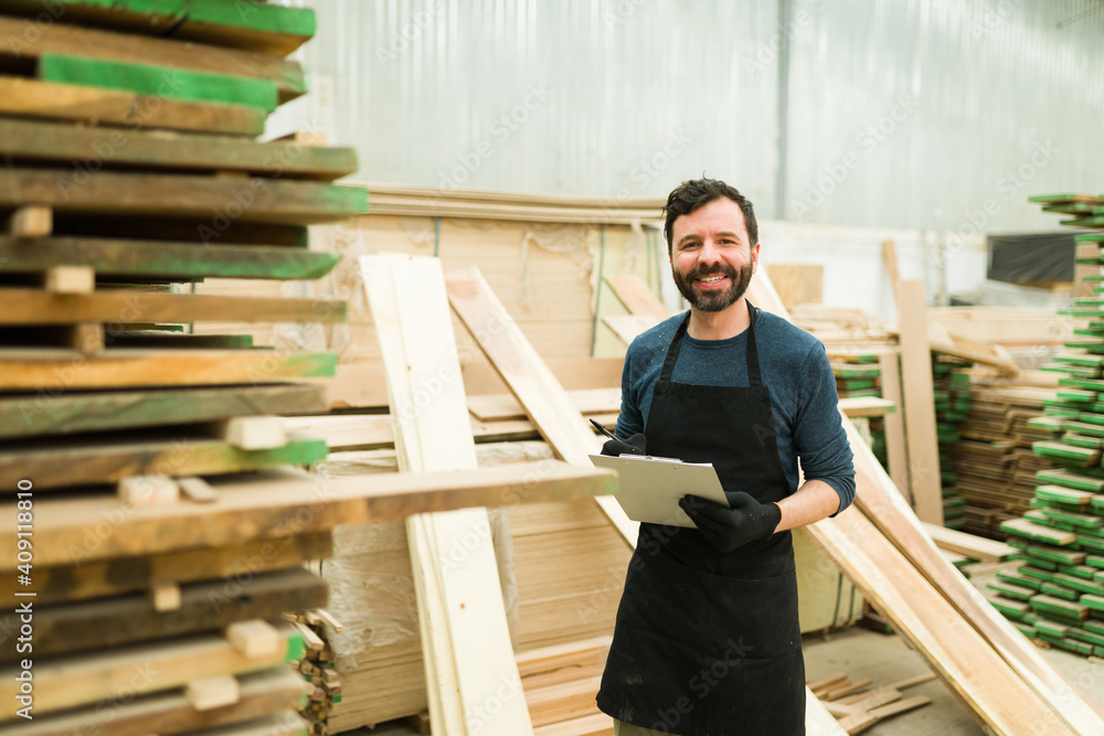Portrait of a happy male worker working on a woodshop Portrait of a happy male worker working on a woodshop