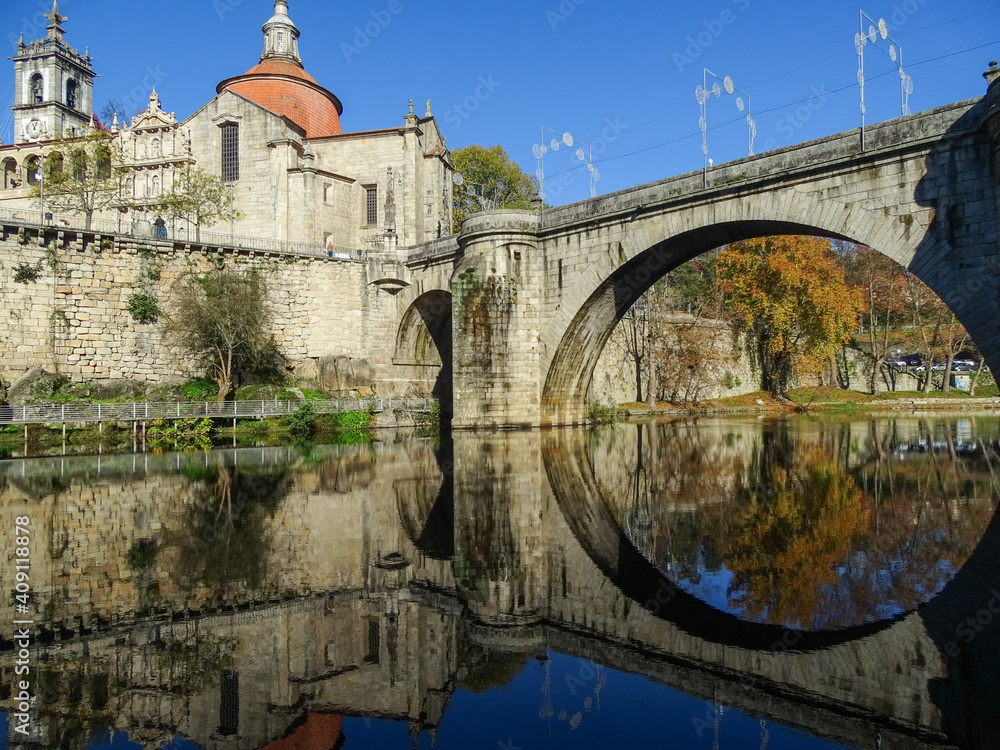 Reflection in water, mirror, buildings and bridge in Peso da Regua, visiting Portugal.