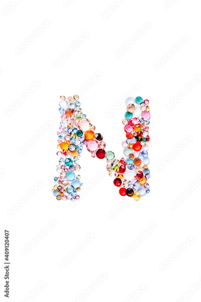 Letter N made from beautiful glass bright gems or crystals on isolated white background