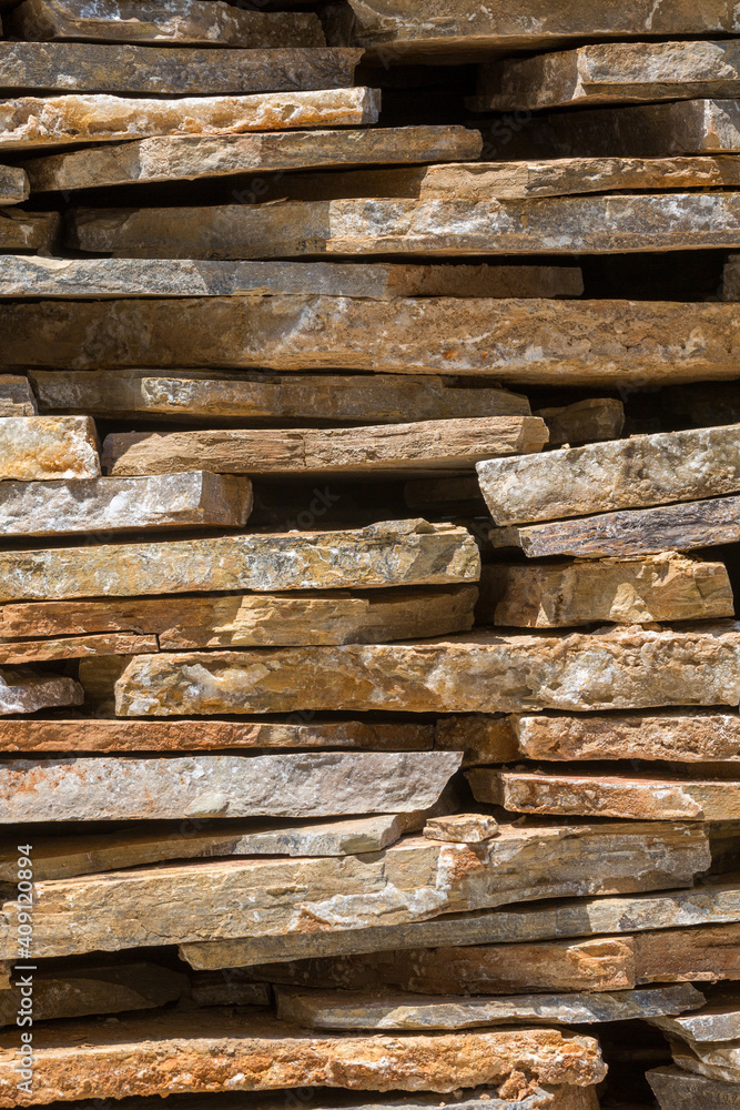Background lined up from elongated stone slabs to a wall vertical photographed Background lined up from elongated stone slabs to a wall vertical photographed
