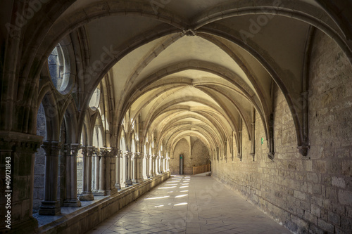 the alley of the gothic cloister of the Noirlac abbey, a monastery situated in Berry region (France)