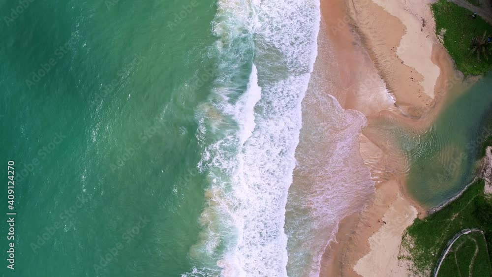 Aerial view drone move Beautiful tropical sandy beach with white sand Wave crashing on sandy shore Top view empty and clean beach.Beautiful Phuket beach is famous tourist destination at Andaman sea Aerial view drone move Beautiful tropical sandy beach with white sand Wave crashing on sandy shore Top view empty and clean beach.Beautiful Phuket beach is famous tourist destination at Andaman sea