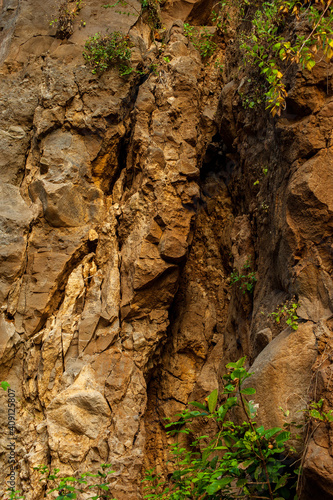 Natural wall of brittle rocks