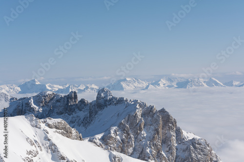 Sunny Dachstein Mountains Extends Over The Clouds To The Horizon