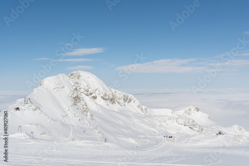 Dachstein Region Shines In The Sunlight Above The Fog Line