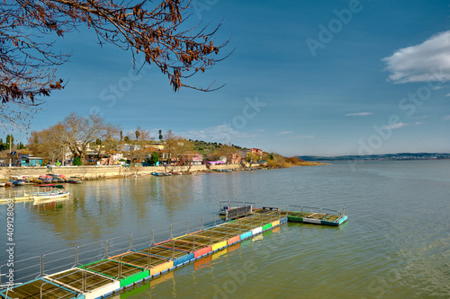 G  lyaz    Apolyont   uluabat lake  Bursa Turkey. 22.01.2021. Panoramic view of uluabat lake and colorful small port and town view with huge mountain backgrd  un.