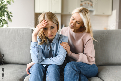 Worried mature mother consoles her adult daughter, helping with problem and depression, caring she, empathy, expressed maternal support. Support of a loved one