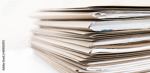 Extremely Close up Stack of Documents Folders on Office Desk Waiting to be Completed