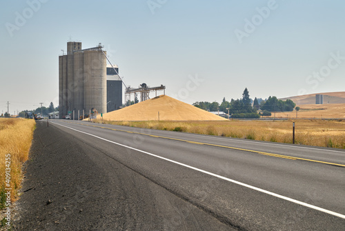 Grain Elevator and Wheat Pile. A stockpile of wheat at a grain elevator in Creston, Washington State, USA.

 photo
