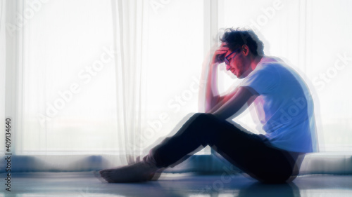 Obraz na plátně man sitting alone at home looking sorrow with desperate and depressed