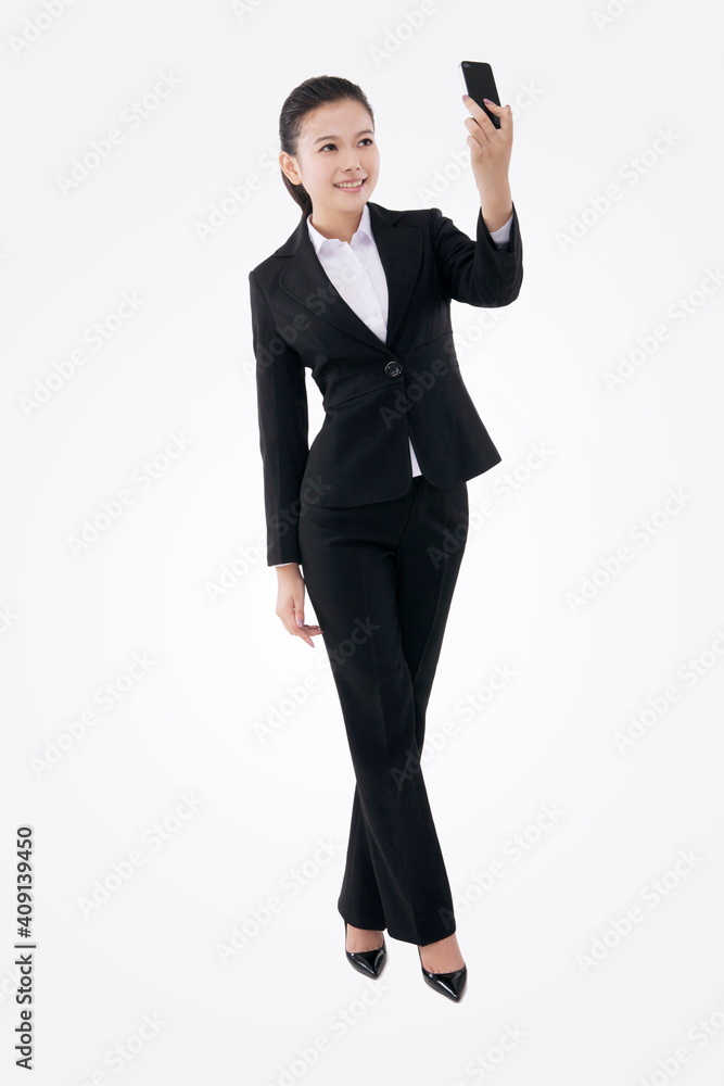 Oriental fashion business woman using mobile phone self-timer Oriental fashion business woman using mobile phone self-timer