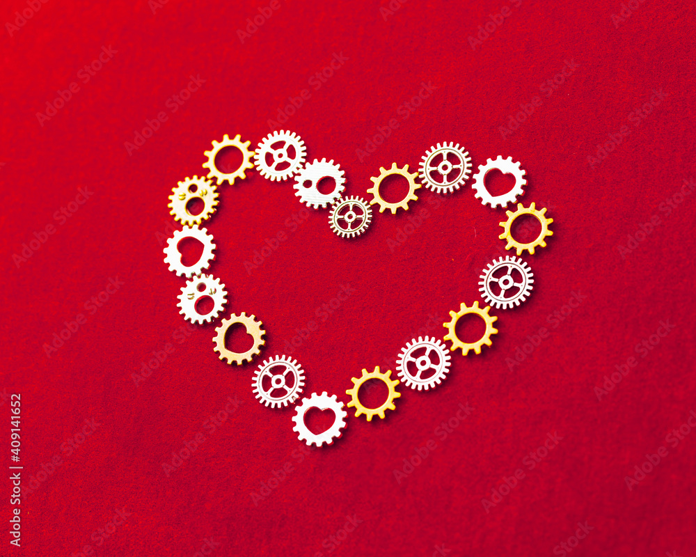 heart shape made of gears, red background heart shape made of gears, red background