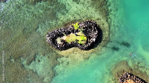 Snorkel Diver Approaches an Offshore Independent Island, The ultimate Hawaiian experience at Kāhala Beach, Honolulu in 2021 photo