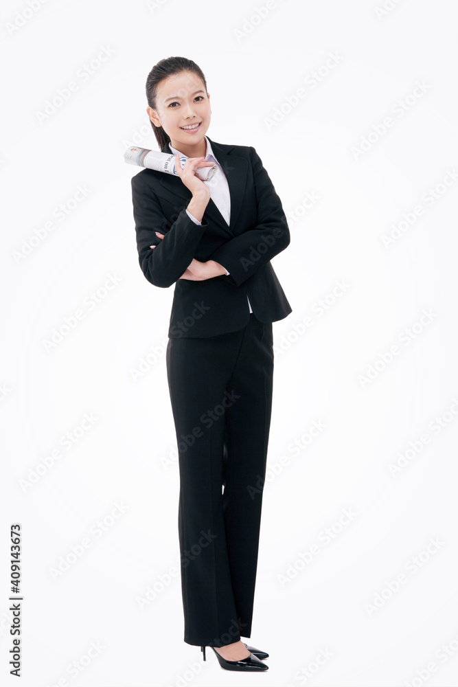 Fashion business woman holding a newspaper in English Fashion business woman holding a newspaper in English