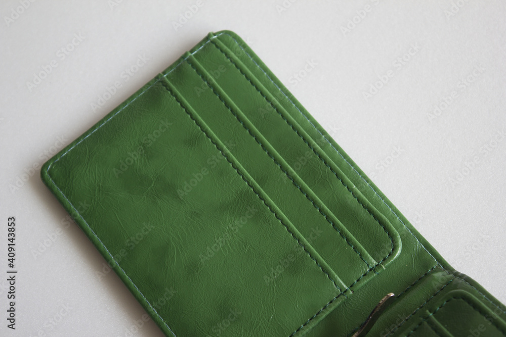 Blank green wallet isolated on white background . Open wallet . Blank green wallet isolated on white background . Open wallet .