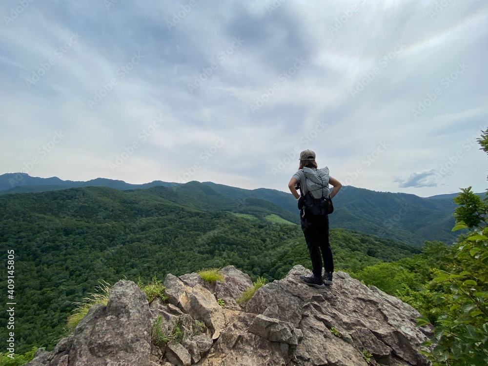 woman on top of mountain