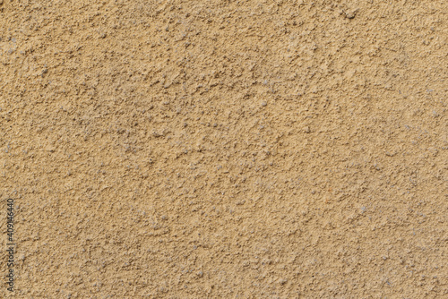 Aged termal isolation yellow wall texture grain rough surface low quality construction in Sofia, Bulgaria, Eastern Europe
