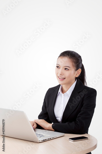 Oriental fashion business woman using computer