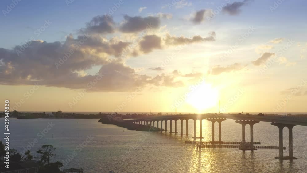 Drone 4K wide pullback from bridge at sunset with boat passing. Belleair Bridge, Clearwater, Florida. Drone 4K wide pullback from bridge at sunset with boat passing. Belleair Bridge, Clearwater, Florida.