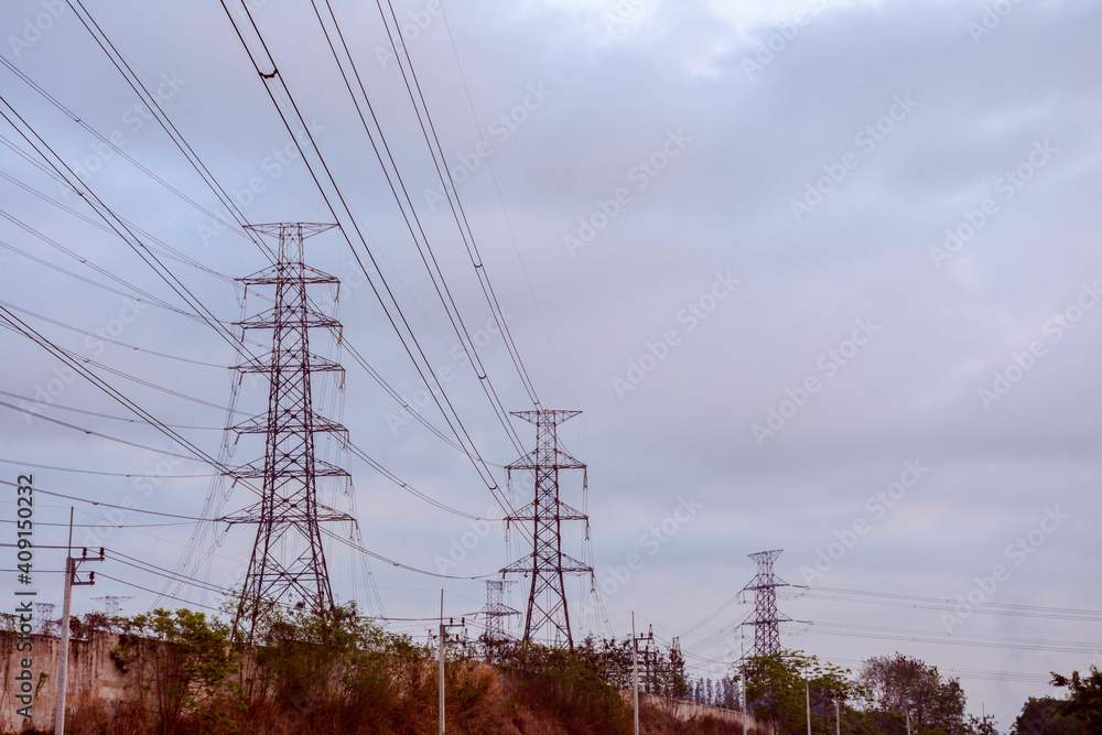 Electricity pole with dark sky before sunrise, Transmission line of electricity to rural, electricity transmission pylon