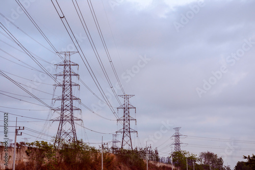 Electricity pole with dark sky before sunrise, Transmission line of electricity to rural, electricity transmission pylon