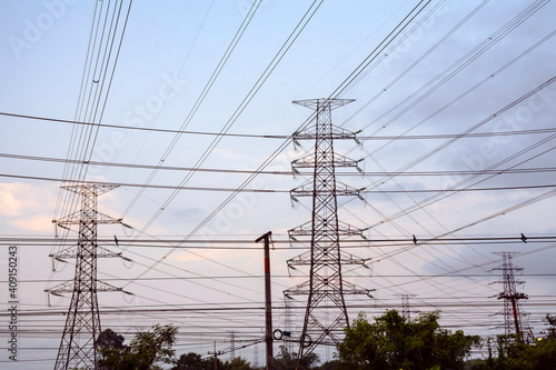 Electricity pole with dark sky before sunrise, Transmission line of electricity to rural, electricity transmission pylon