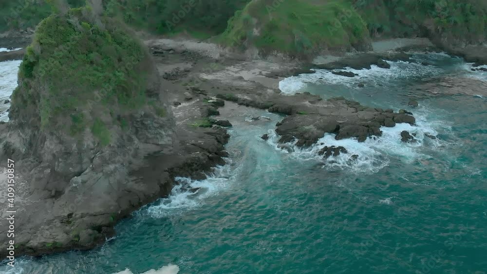 Aerial landscape view of Watulumbung rock beach showing isolated small hill - seri 2 Aerial landscape view of Watulumbung rock beach showing isolated small hill - seri 2