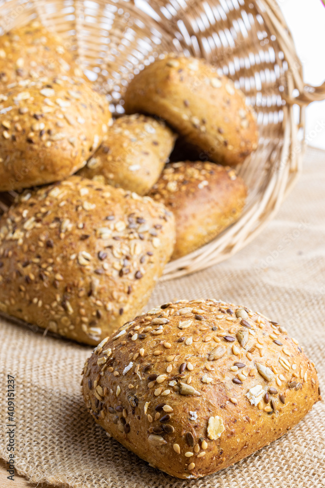 Loaf bread. Rye bakery with crusty loaves and crumbs. Fresh loaf of rustic traditional bread with wheat grain ear or spike plant on natural cotton background. Bio ingredients, very healthy seeds. Loaf bread. Rye bakery with crusty loaves and crumbs. Fresh loaf of rustic traditional bread with wheat grain ear or spike plant on natural cotton background. Bio ingredients, very healthy seeds.