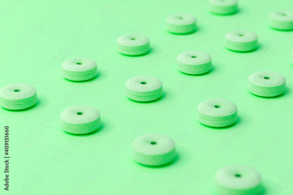 Tablet and colorful surface layer. The image of medicine and candy. Tablet and colorful surface layer. The image of medicine and candy.