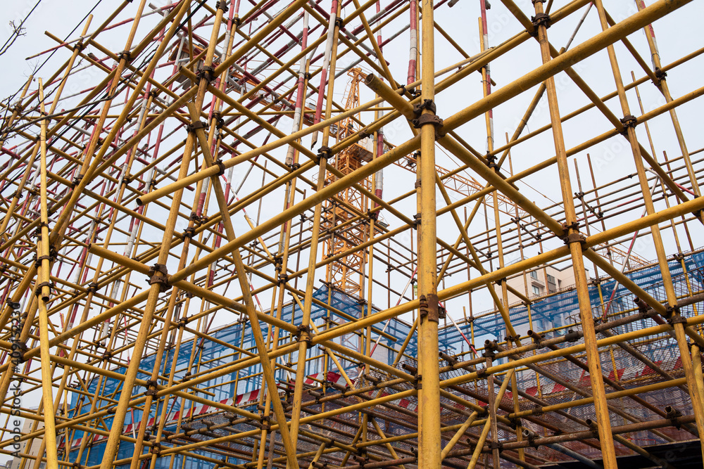 Fototapeta premium Scaffolding construction site infrastructure labor