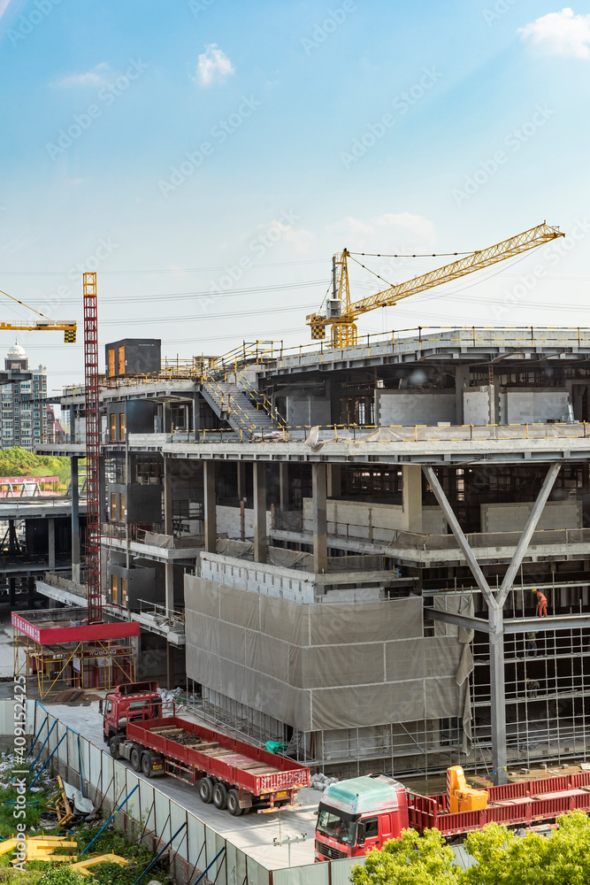 Construction site background. Crane and building under construction