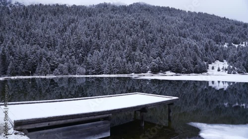Wallpaper Mural Pan across a winter lakes with mountains, trees and a cabin. Torontodigital.ca