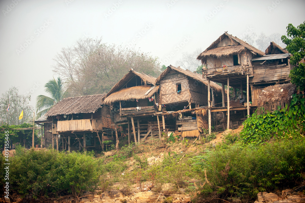 Villages in rural northern Thailand, houses made of wood and bamboo on the hills, misty morning gives a refreshing view, rustic style houses of Karen people. Famine and poor